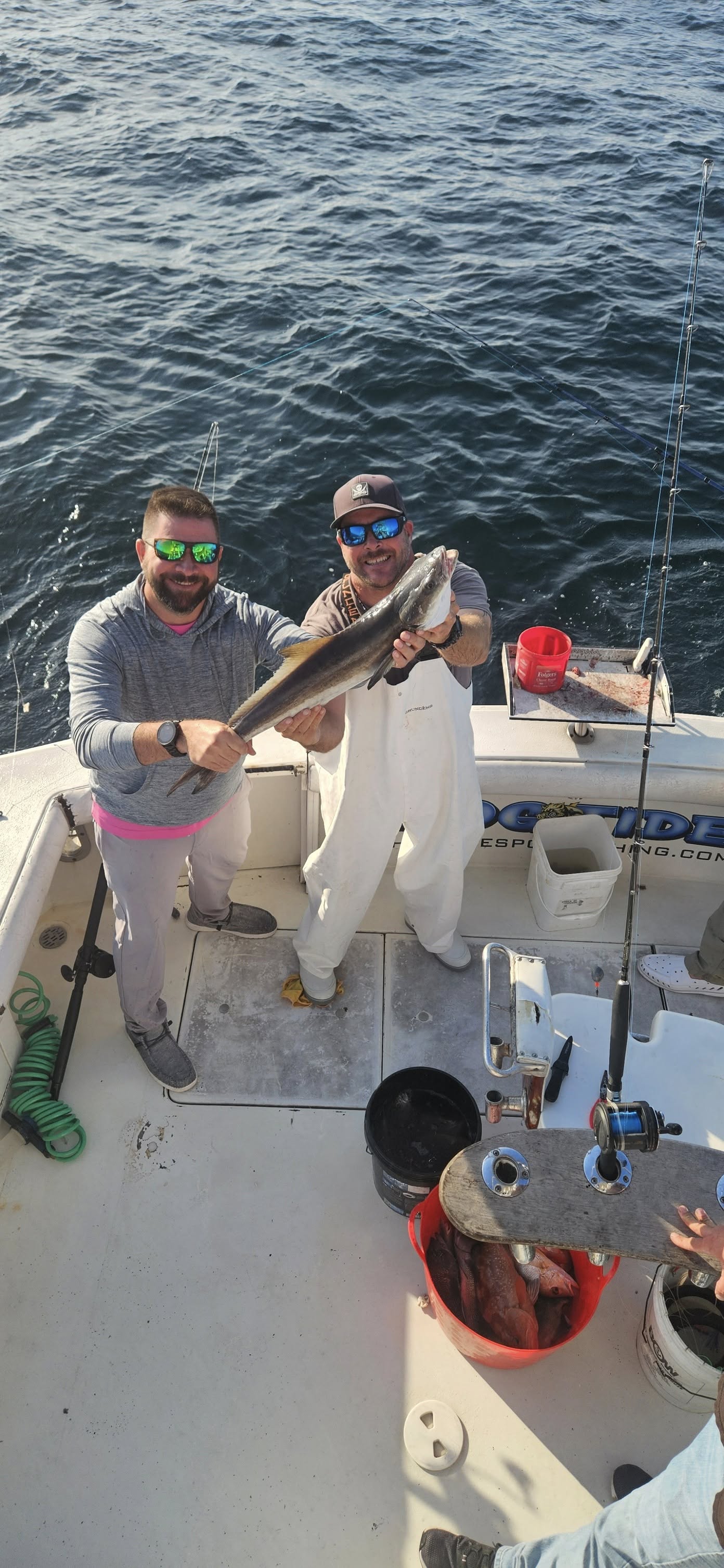 Two people fishing for a king mackerel at New Smyrna Beach