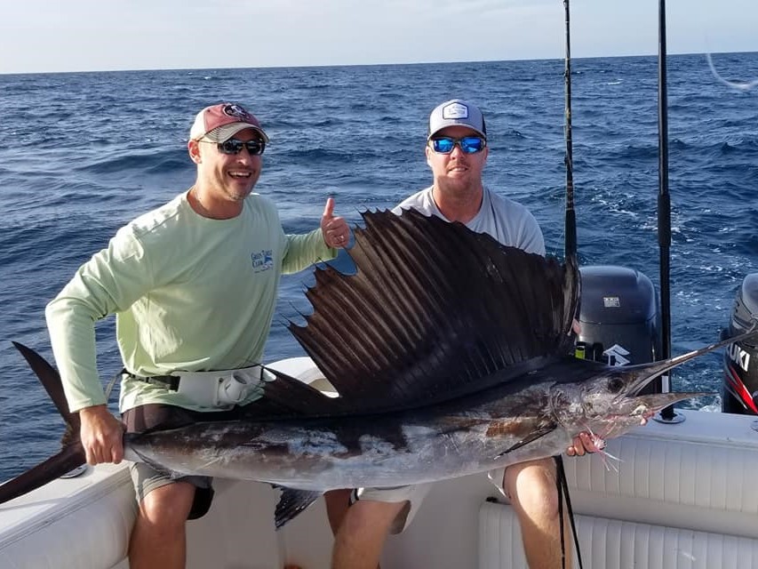 New Smyrna Beach fishing boat at offshore reef with anglers catching fish on 6-hour wreck trip