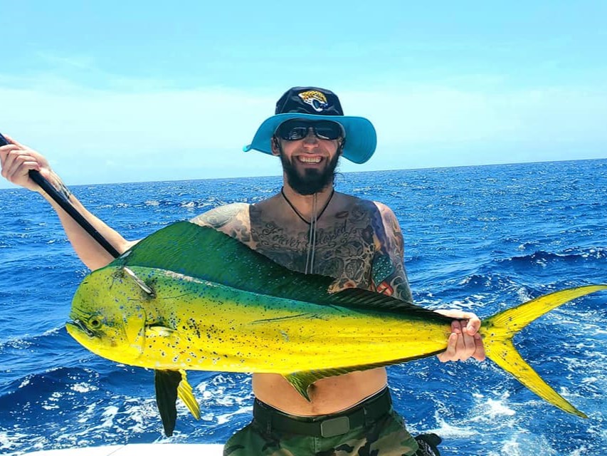 New Smyrna Beach offshore fishing boat trolling for Mahi Mahi with 6 anglers on deck