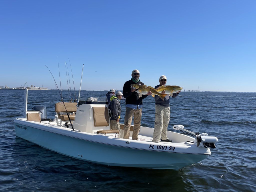 A group of 3 people fishing on the coast in FL
