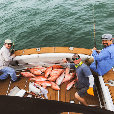 A group of 3 people fishing in TX
