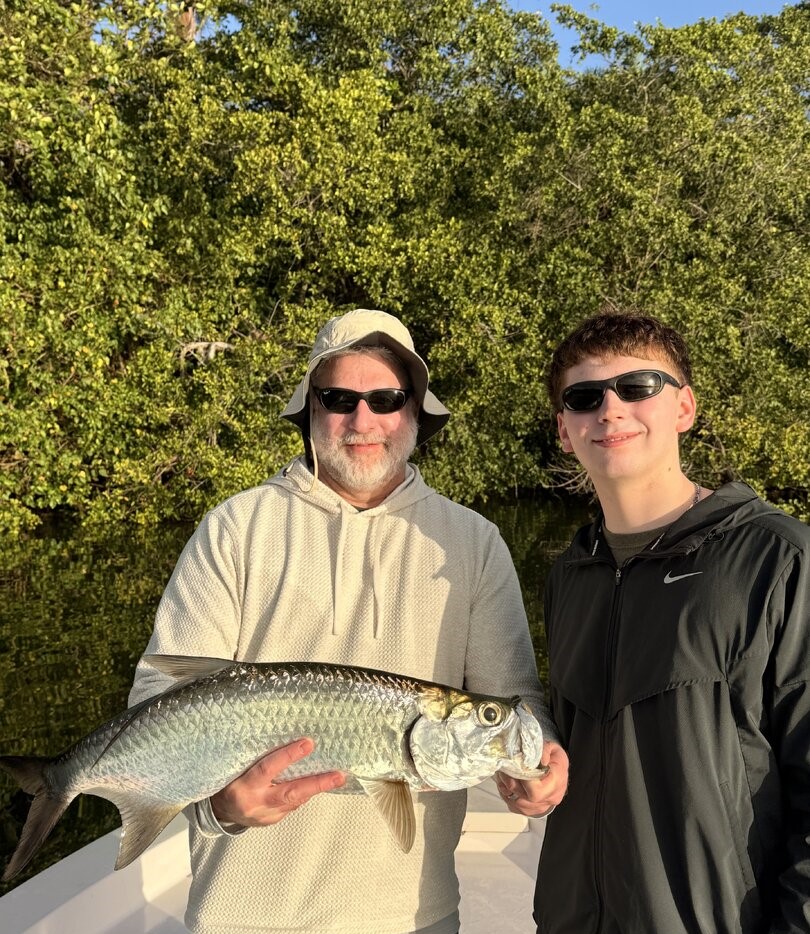 Tarpon fishing catch in San Juan PR with two anglers displaying their fish