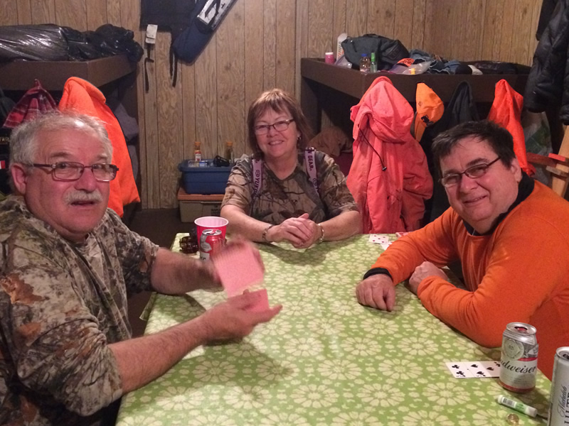 Three people enjoying a fishing and hunting trip in ON