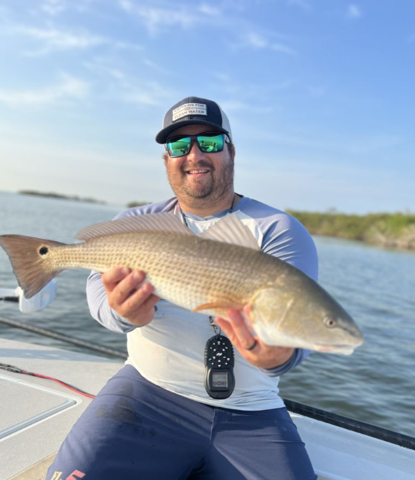 Angler with a fishing rod in Edgewater