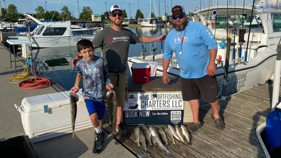 3 people holding a 16-inch fish in OH
