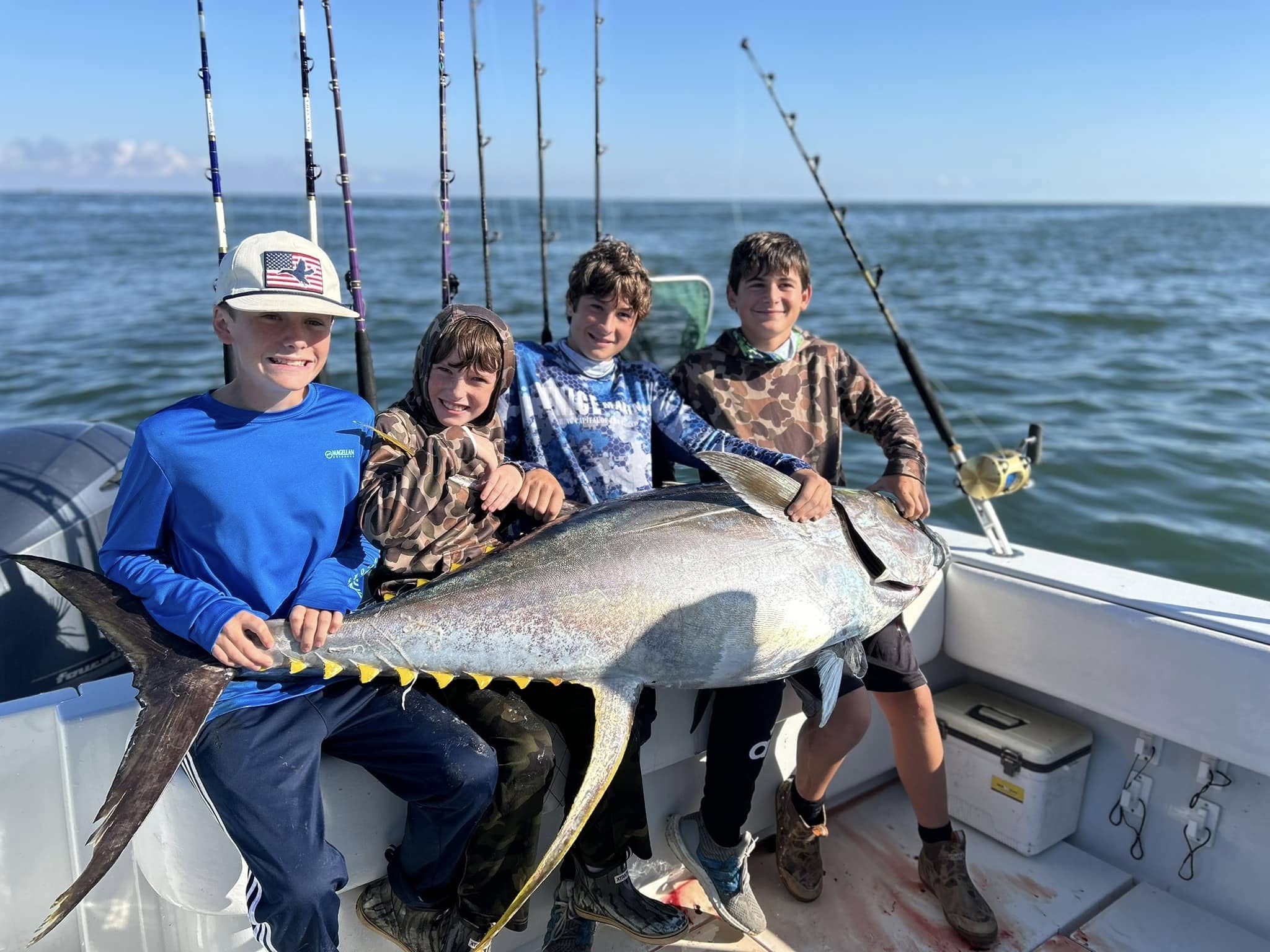 Four people fishing in an unknown location