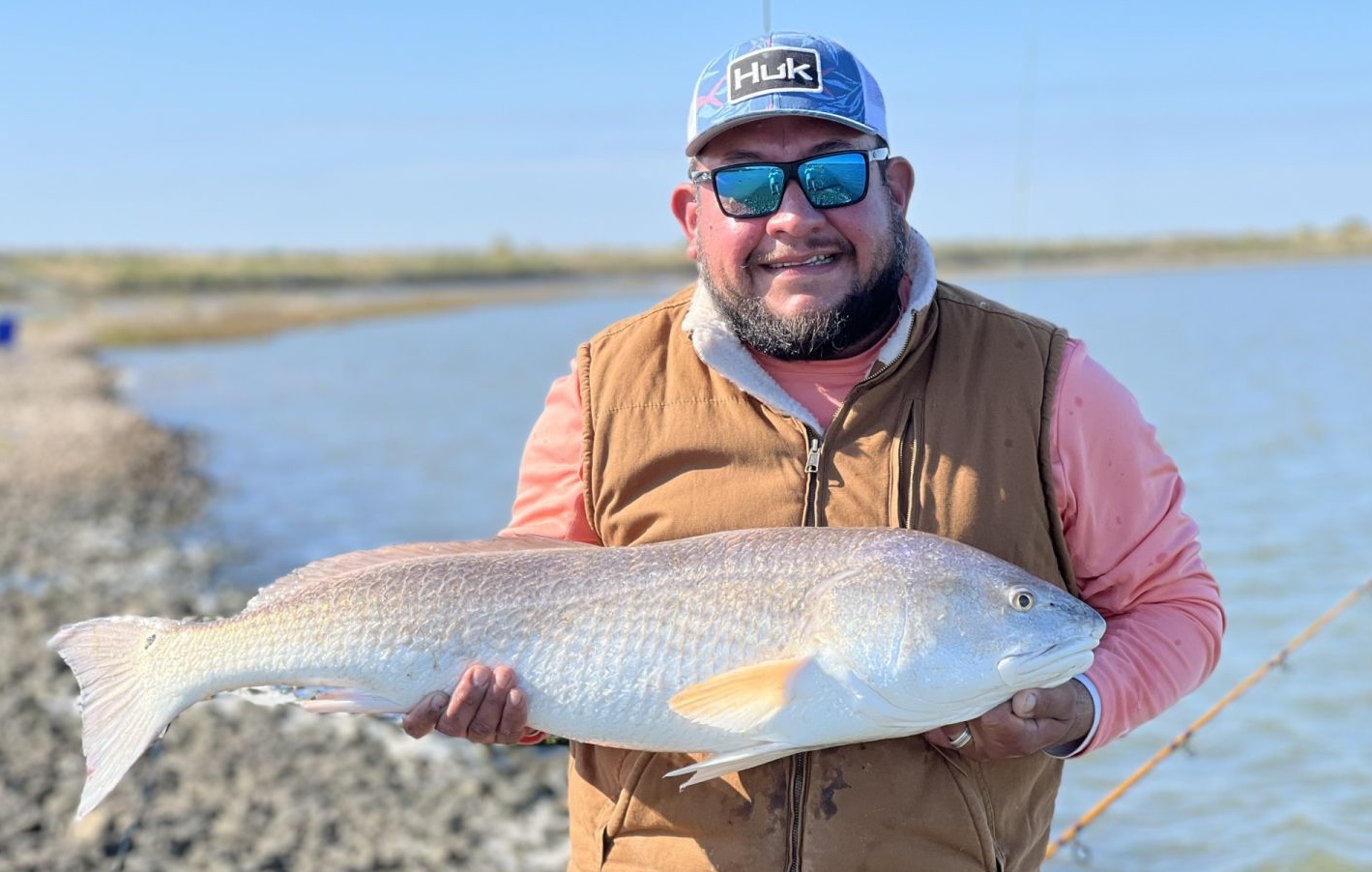 A fisherman catching a 24-inch fish in Galveston