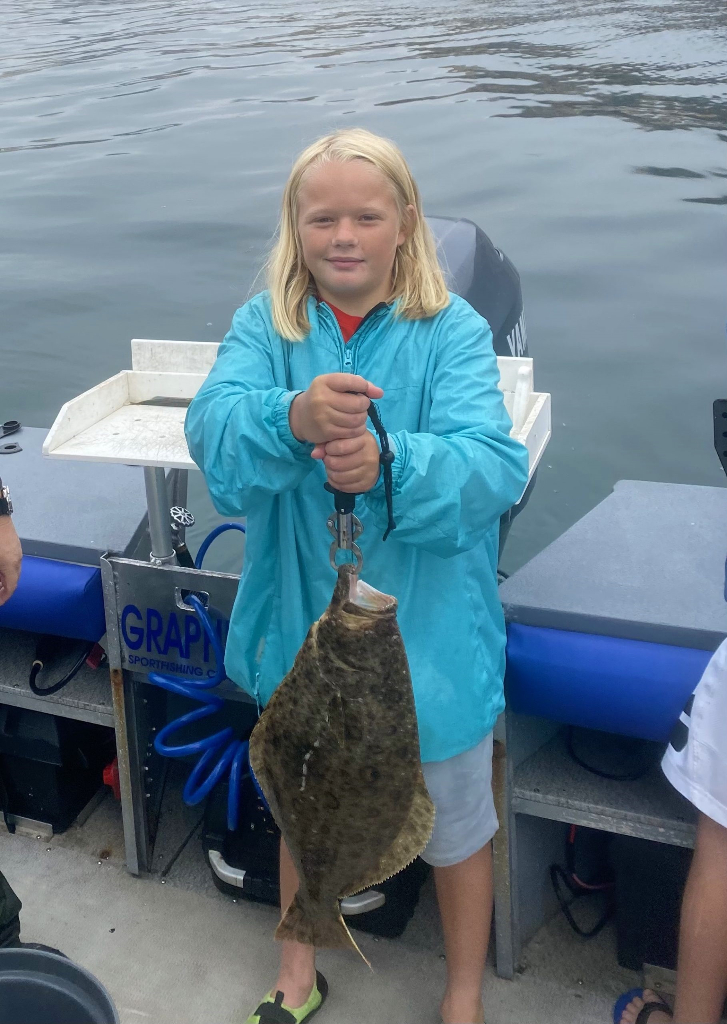 Angler with a 18-inch fish caught in Oxnard