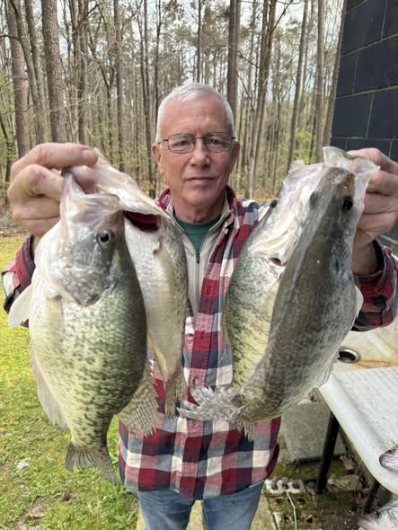 Angler displays caught fish at Pope MS fishing location