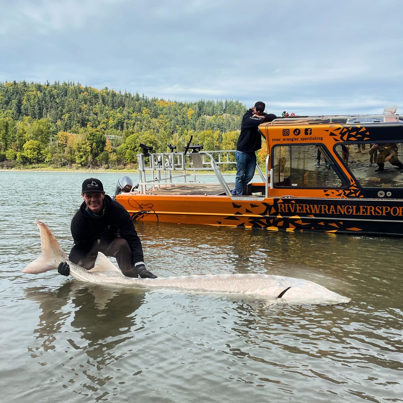 A fishing scene with 2 people in Chilliwack