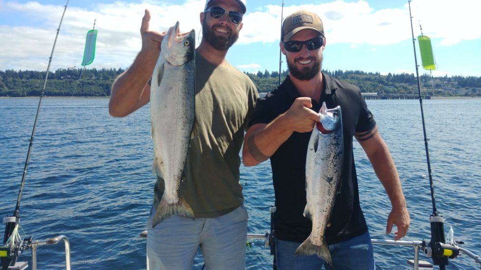 Two anglers fishing for coho salmon and sea trout in Edmonds