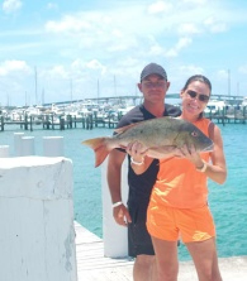 two people fishing in nassau, bahamas