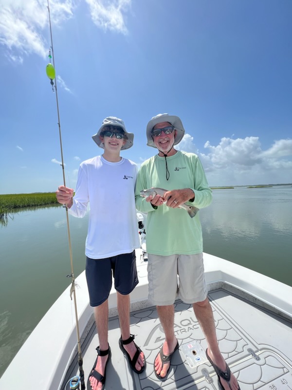 Two people enjoying fishing in Port Royal