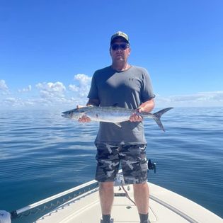 Angler with big fish in Placida
