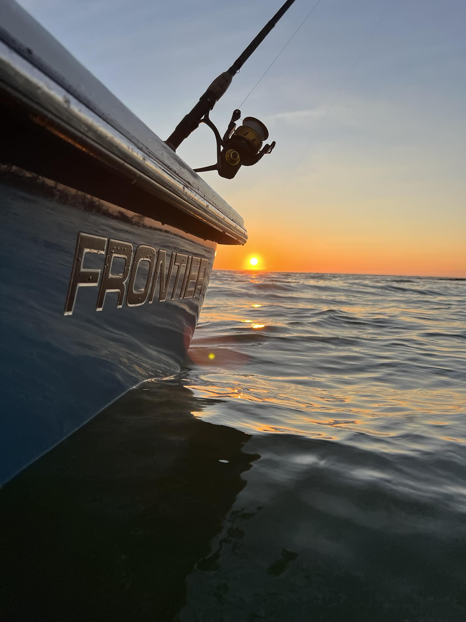 Marco Island sunset boat tour with captain navigating Gulf of Mexico coastal waters at dusk