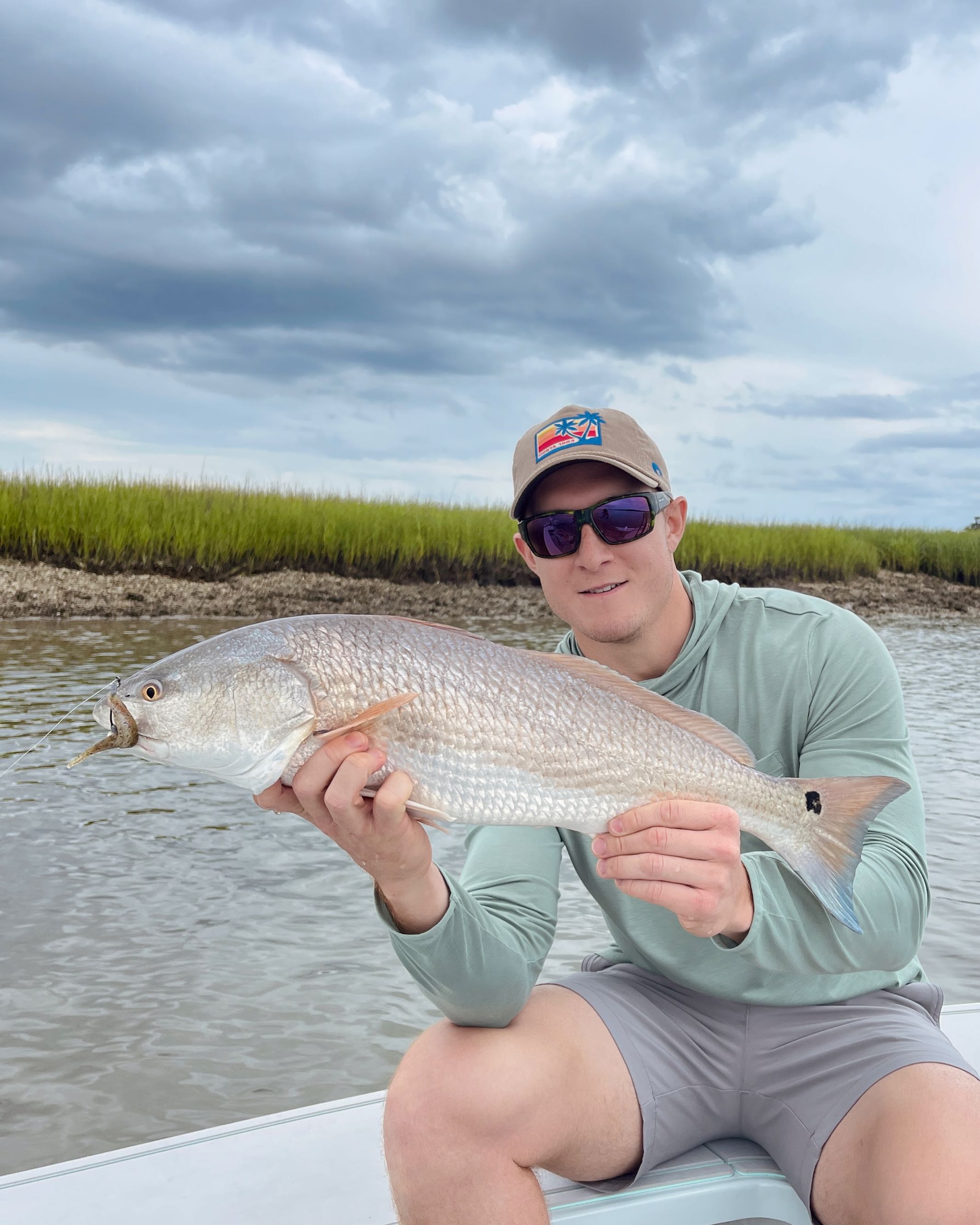 Angler fishing in GA, with a 25-inch fish