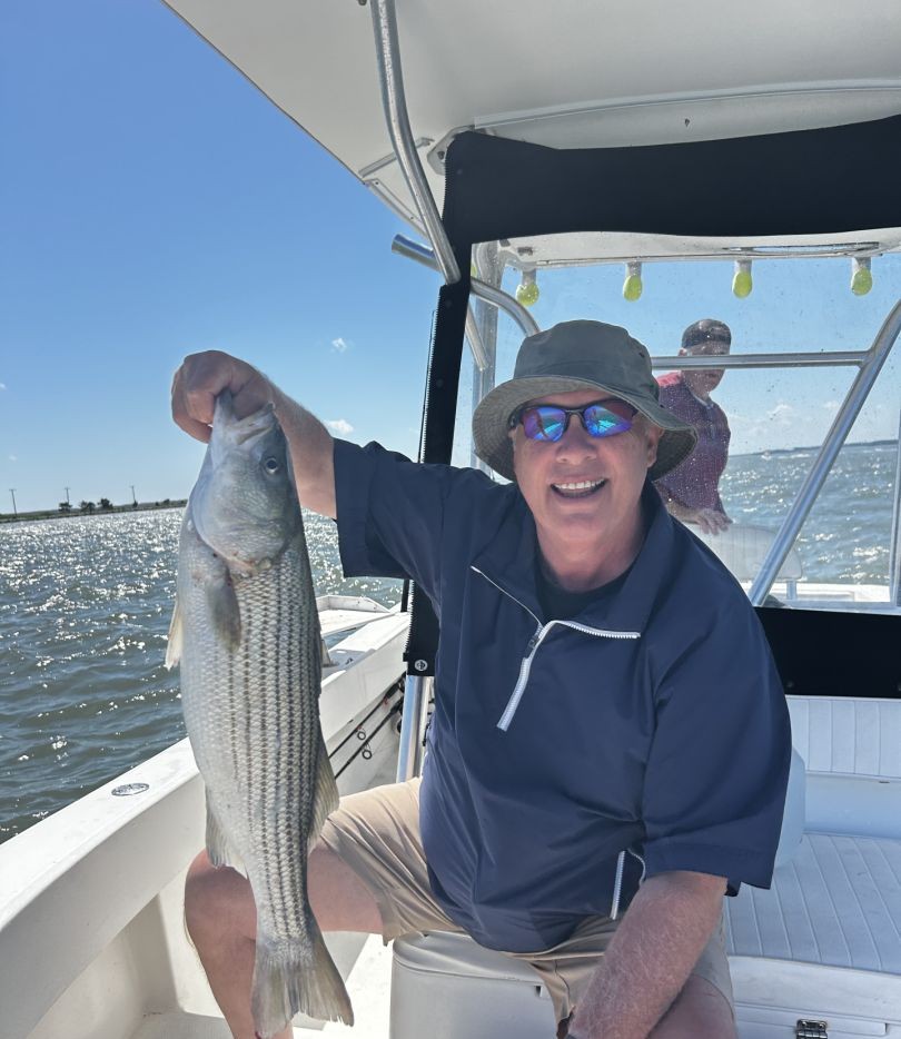 Striped bass caught by two people in DE
