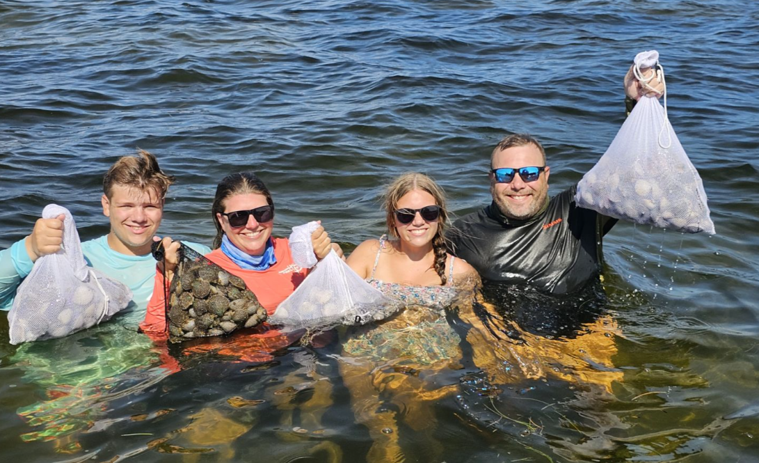 4 people fishing outdoors in FL