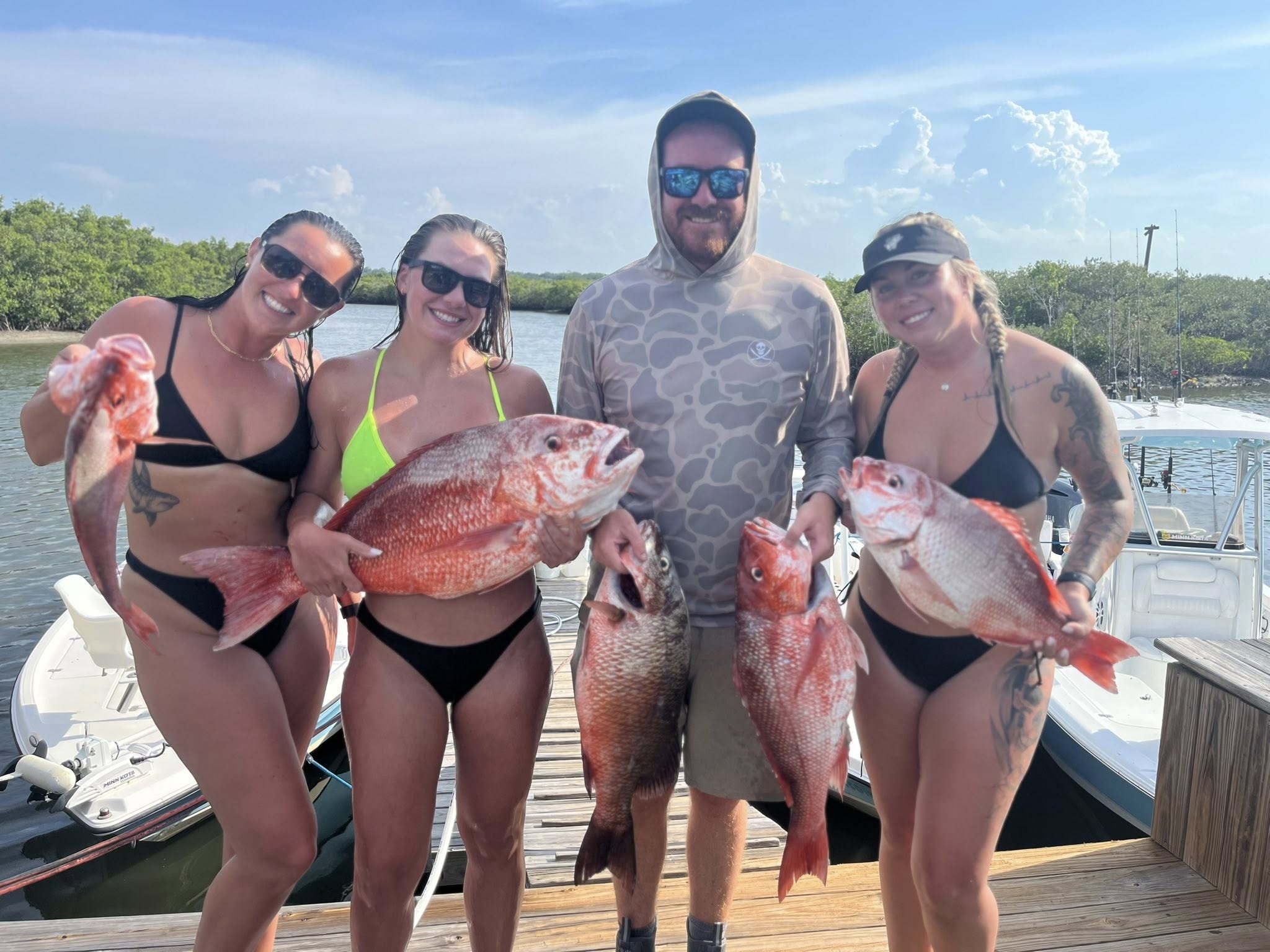 4 anglers with 5 fish caught while fishing in FL