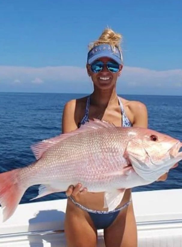 Fisherman holding a catch in FL