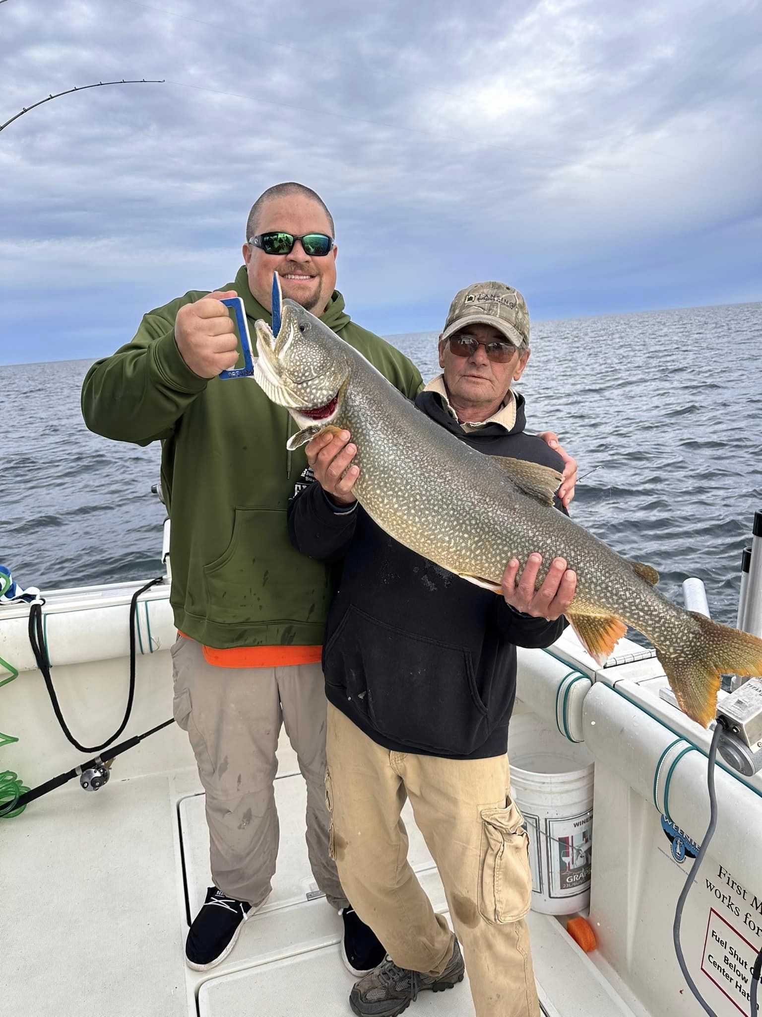 Three people fishing in MI
