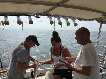 Three people fishing in La Salle
