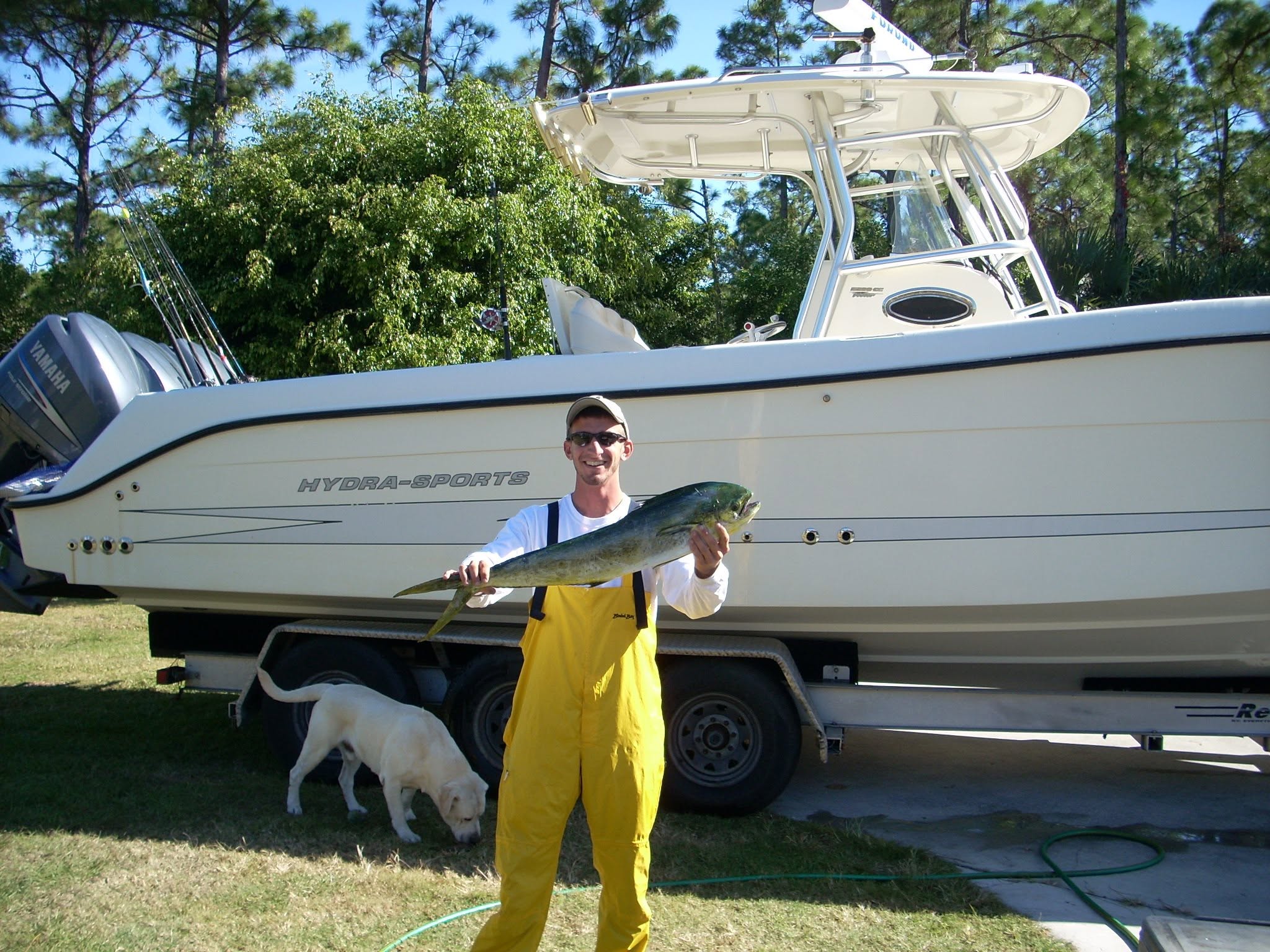Mahi mahi fishing catch displayed next to Hydra-Sports boat in Sebastian FL