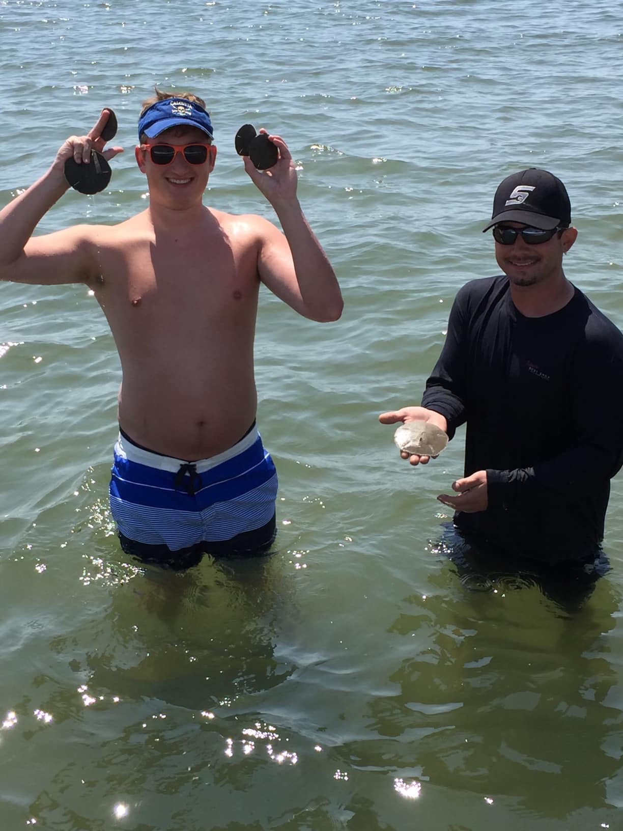 Two people enjoying a fishing tour in North Carolina