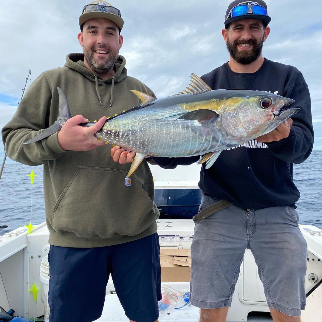 Yellowfin tuna, a large fish caught by two people in NY