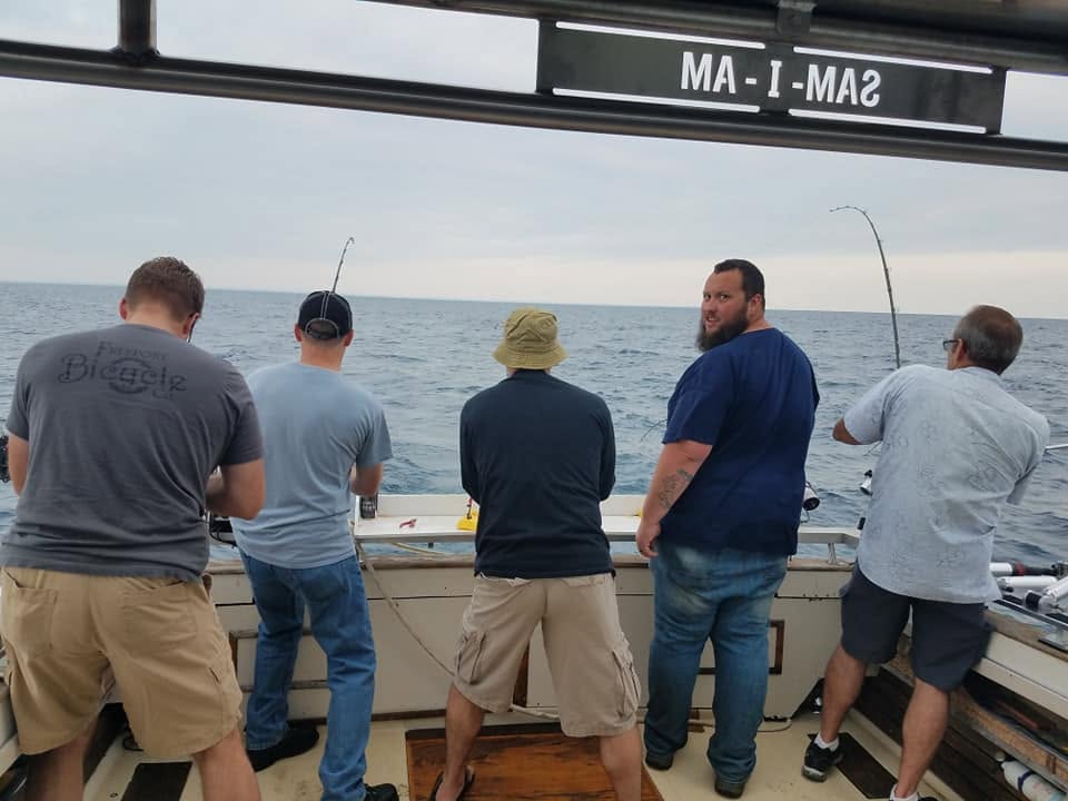 Fishing charter boat with anglers on Lake Michigan near Racine WI