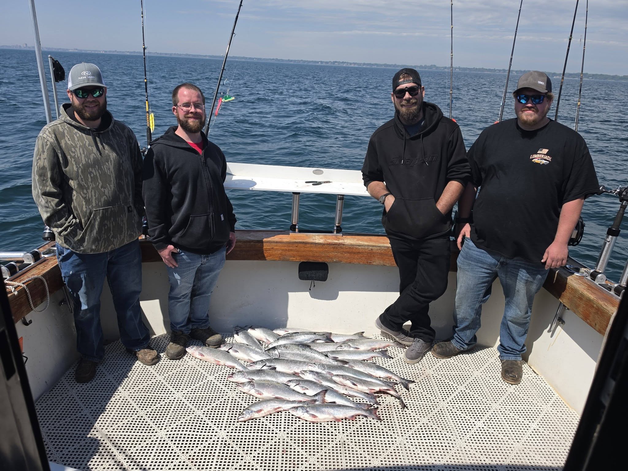 Fishing charter boat with multiple salmon laid out on deck in Racine WI waters