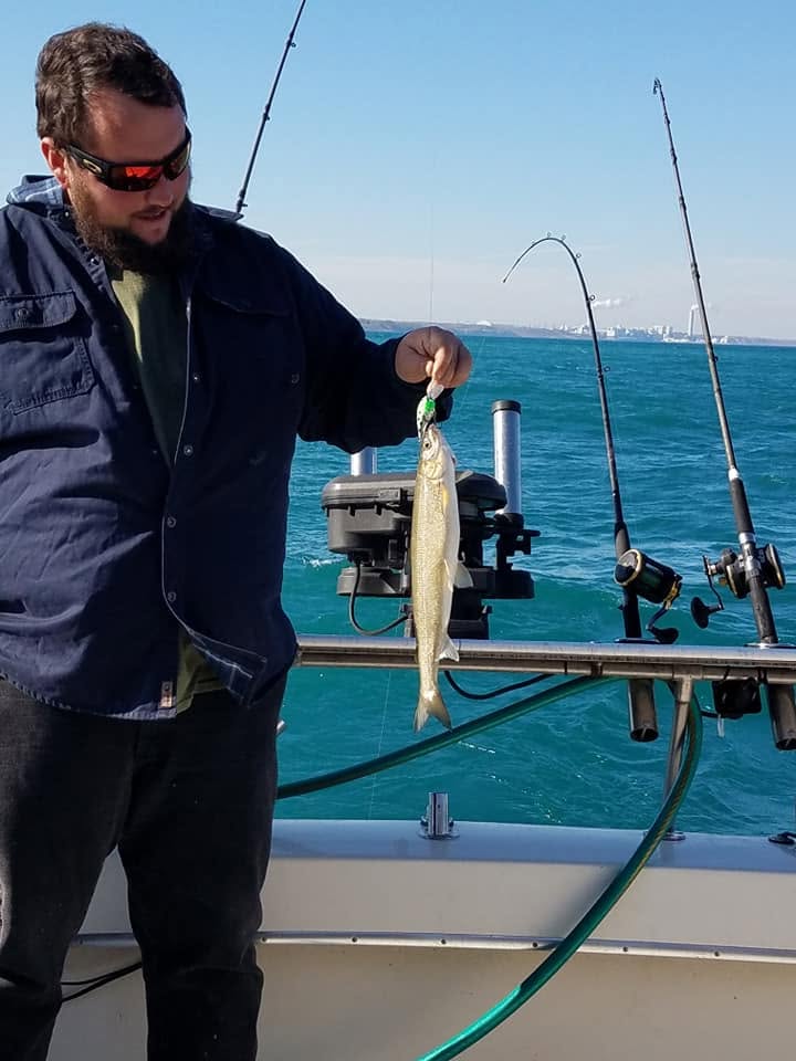 Fresh caught fish held up on fishing boat in Racine WI waters