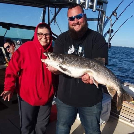 Family fishing charter boat on Lake Michigan near Racine with salmon fishing gear for beginners