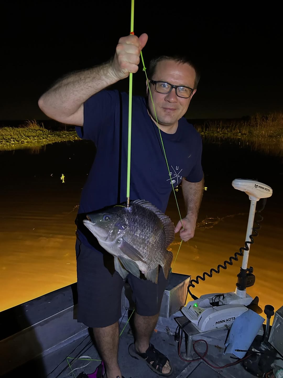 Night fishing catch with large fish on boat in Saint Cloud FL