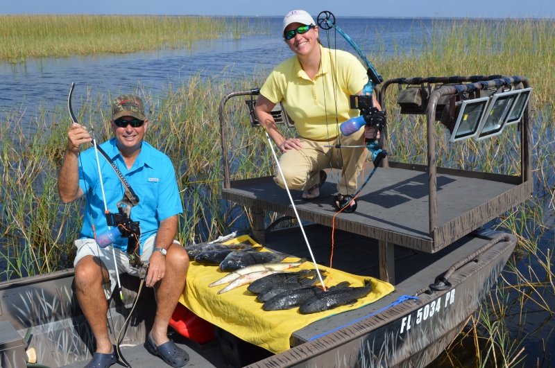 Fishing boat on water with marsh grass in Saint Cloud FL showing fishing equipment and platform