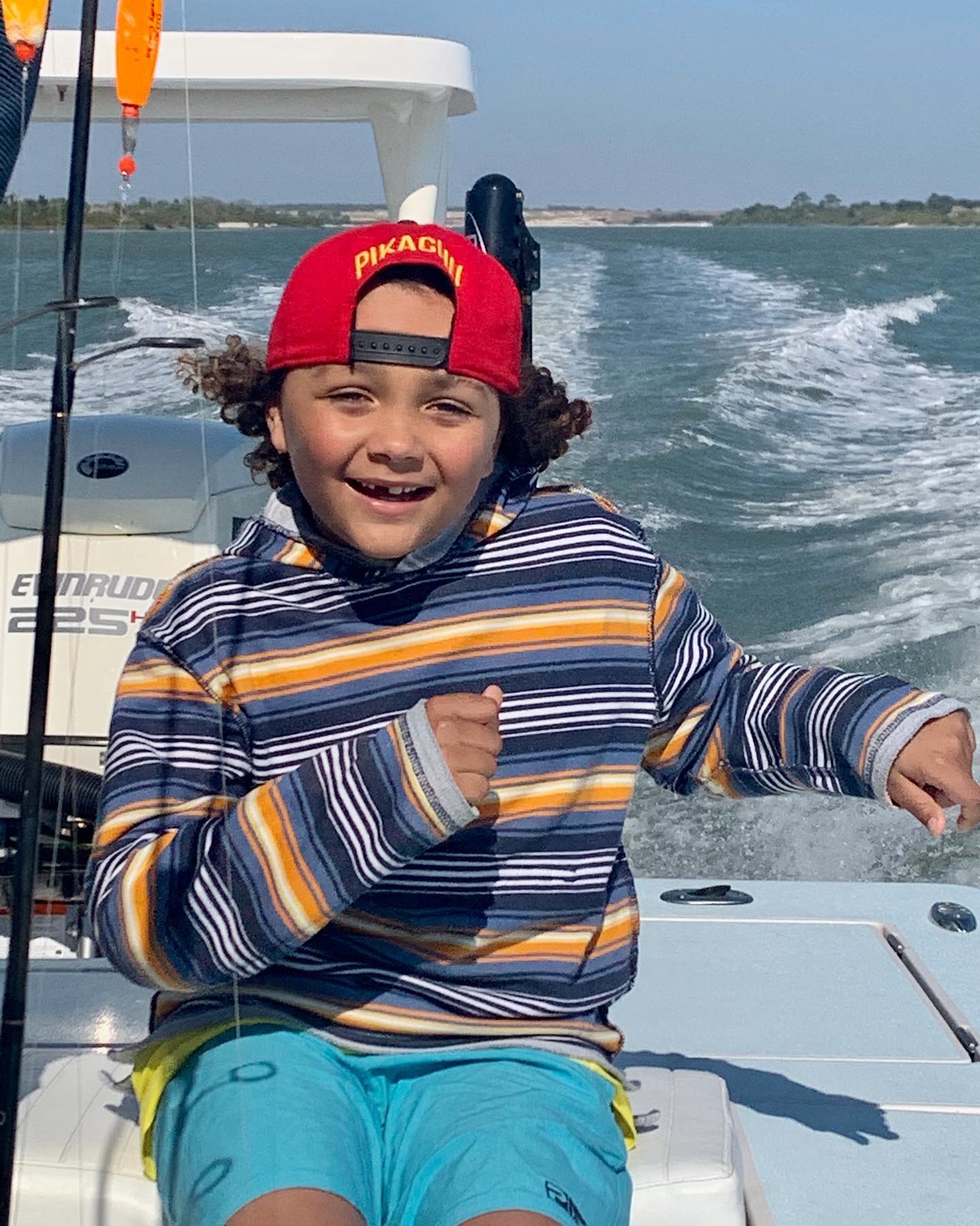 Family fishing charter boat in St. Augustine with kids catching fish inshore waters