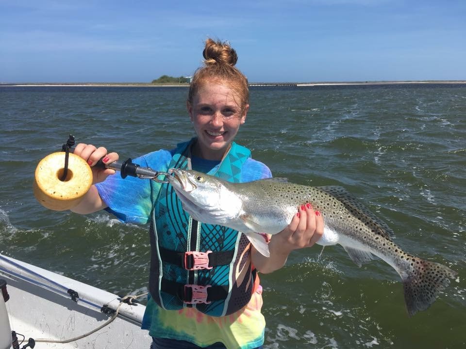 A lone fisherman reeling in a big catch in TX