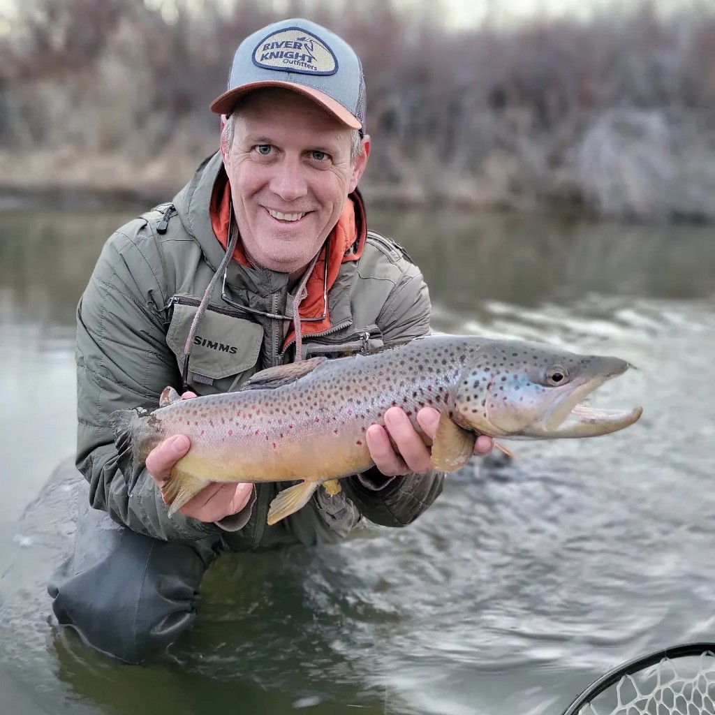 Proud angler with a beautiful sea trout catch from MT