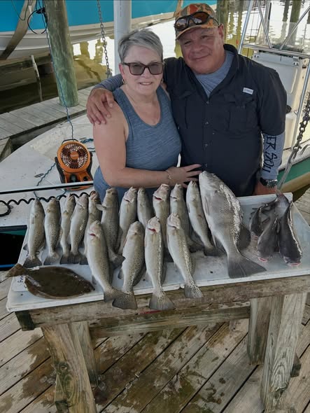 Fishing catch display showing Black Drum and American Eel from Slidell LA