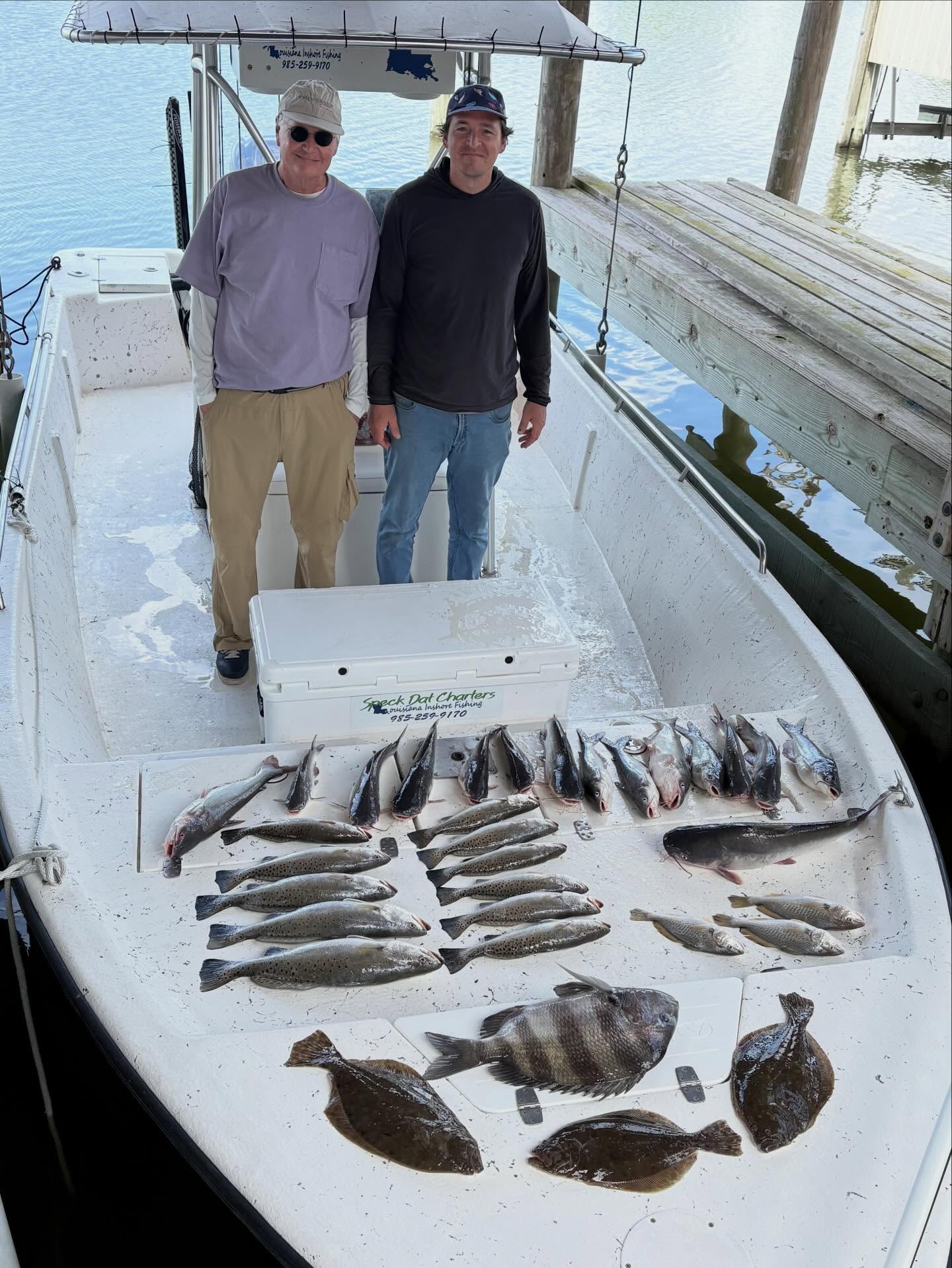 Fishing charter boat displaying catch of sheepshead, speckled trout, summer flounder and hardhead catfish in Slidell Louisiana