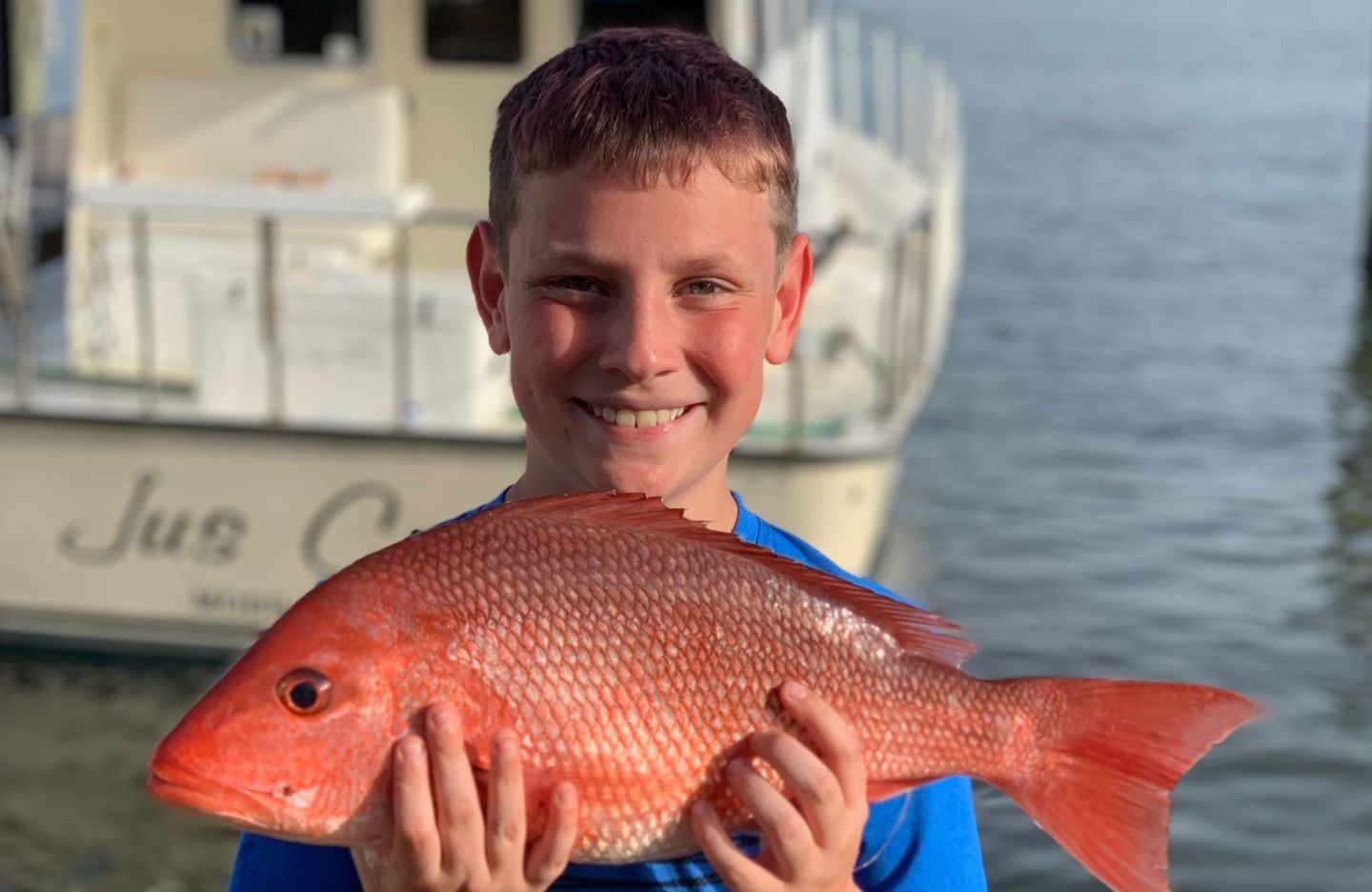 Fisherman catching a 19-inch fish in Orange Beach