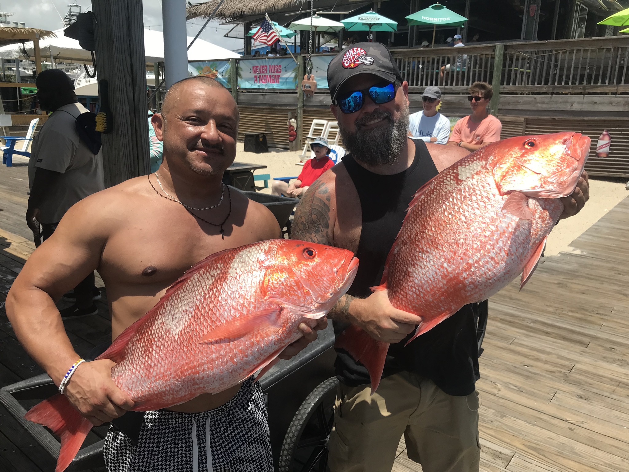 Two fishermen with a successful catch at Orange Beach