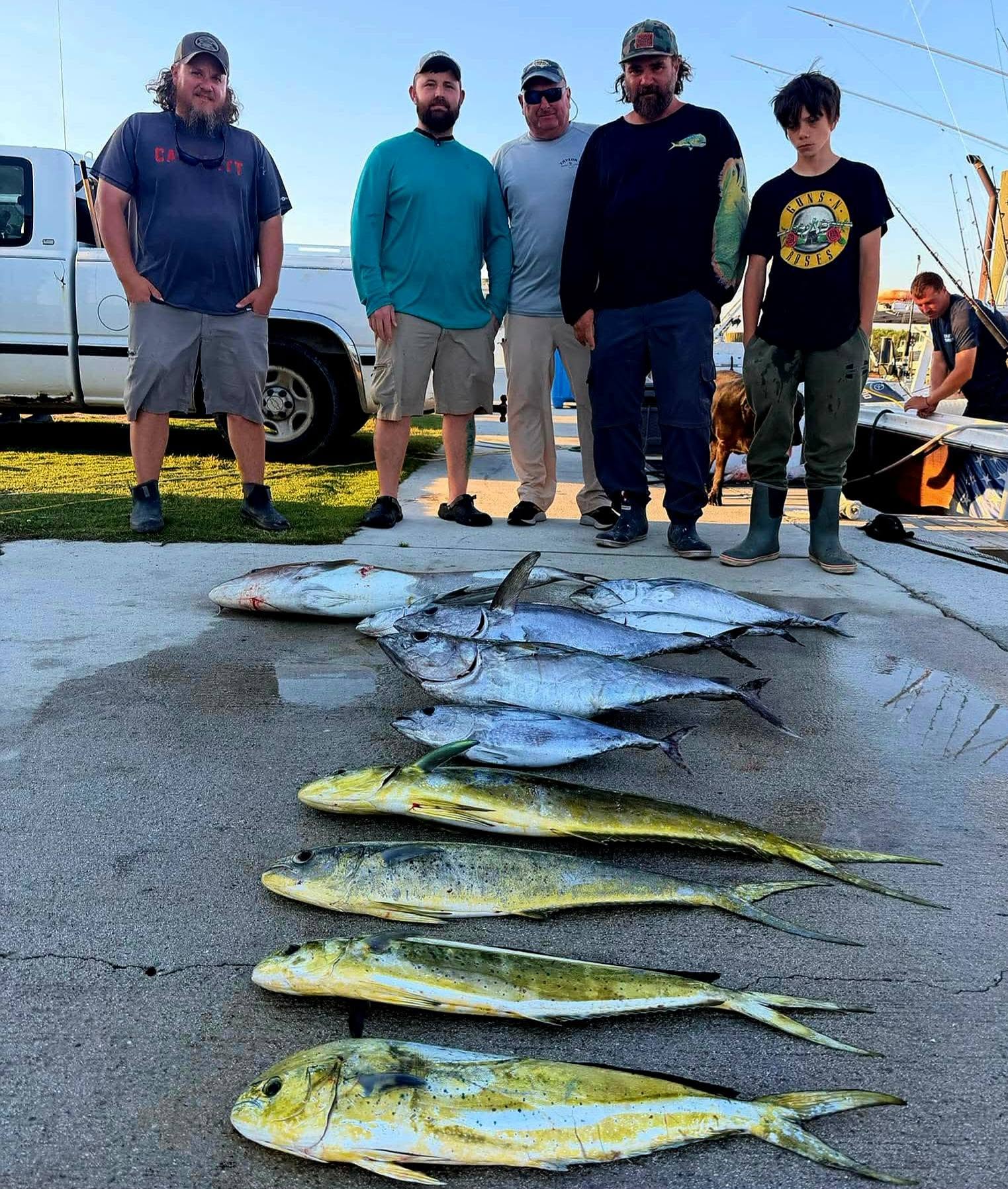 Fishing catch display of mahi mahi and bluefin tuna laid out on dock in Sneads Ferry NC