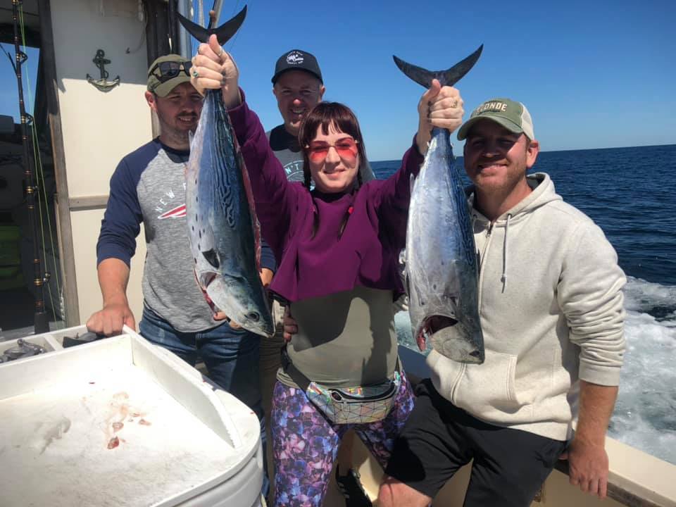 4 people holding large fish in Montauk