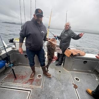 Fishing charter in Chugiak Alaska with fresh caught fish on boat deck