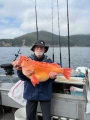 Large orange rockfish caught while fishing in Chugiak Alaska