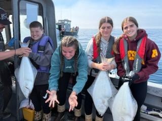 Pacific halibut fishing catch displayed on boat in Chugiak Alaska