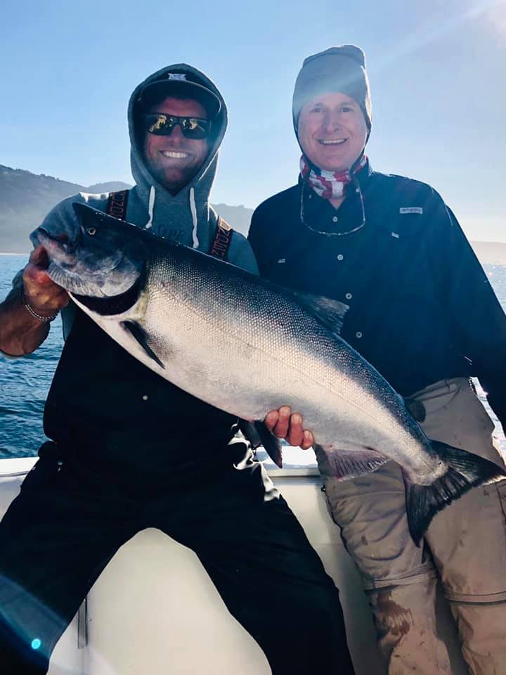 Two anglers with a single, large 29-inch fish