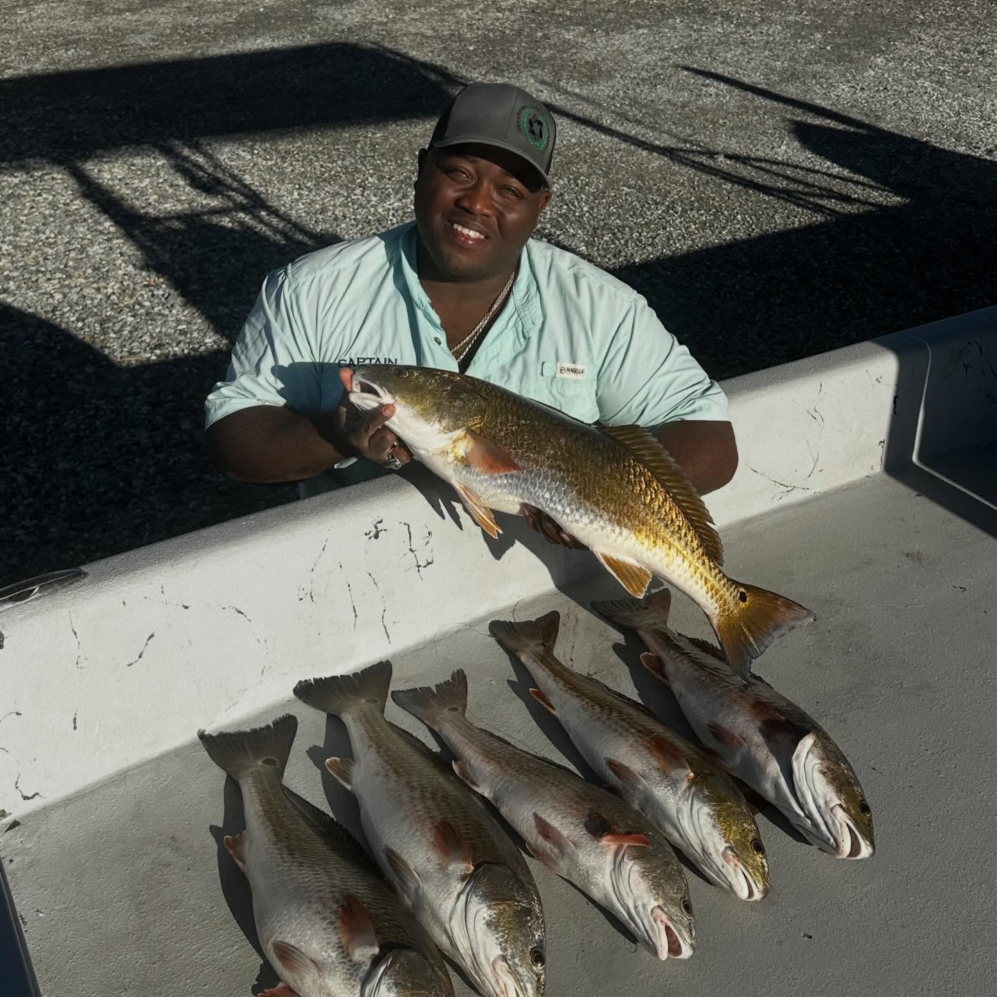 Successful redfish catch displayed on boat deck in Port Arthur TX
