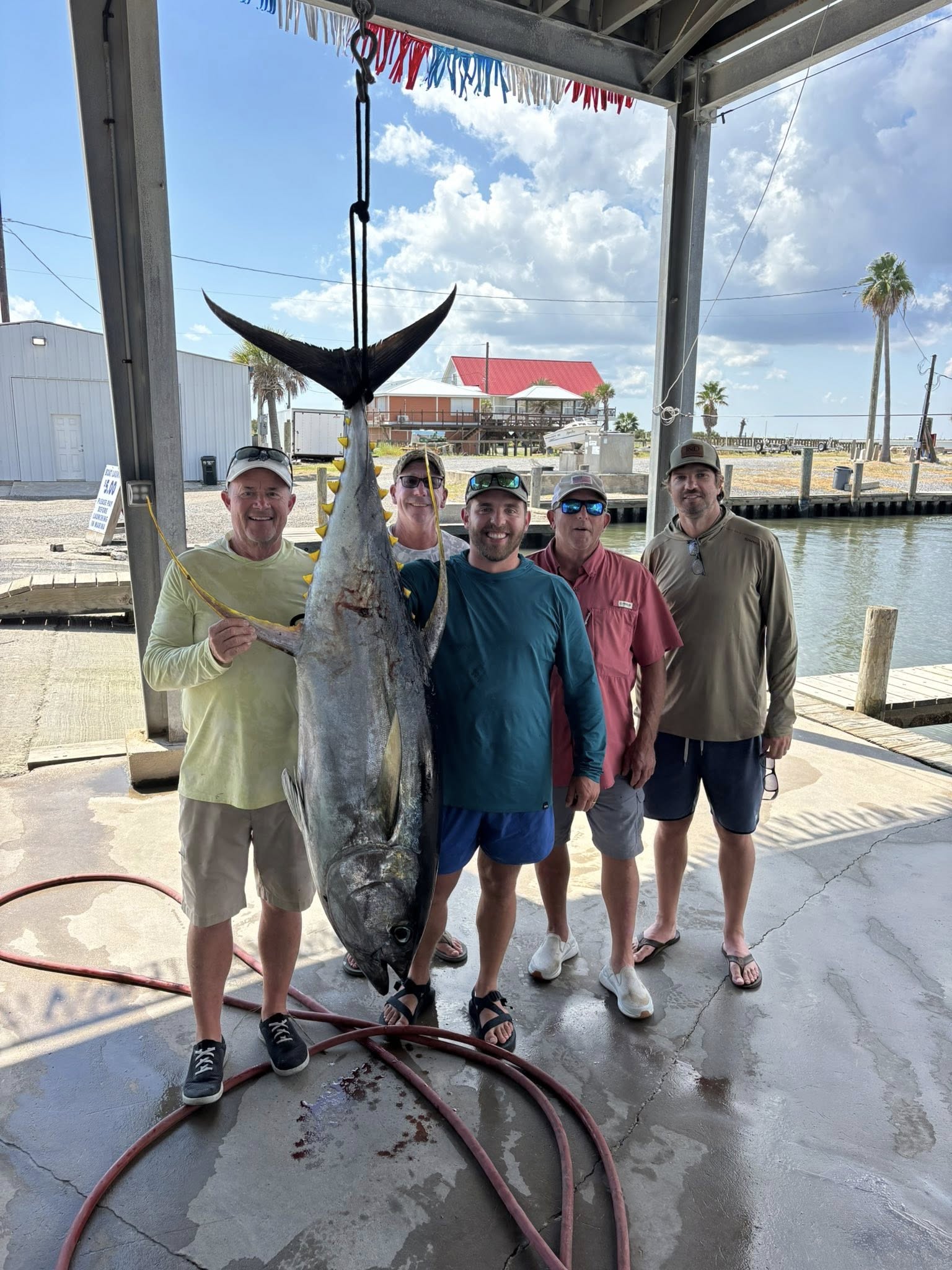 Group of 5 people fishing at Grand Isle